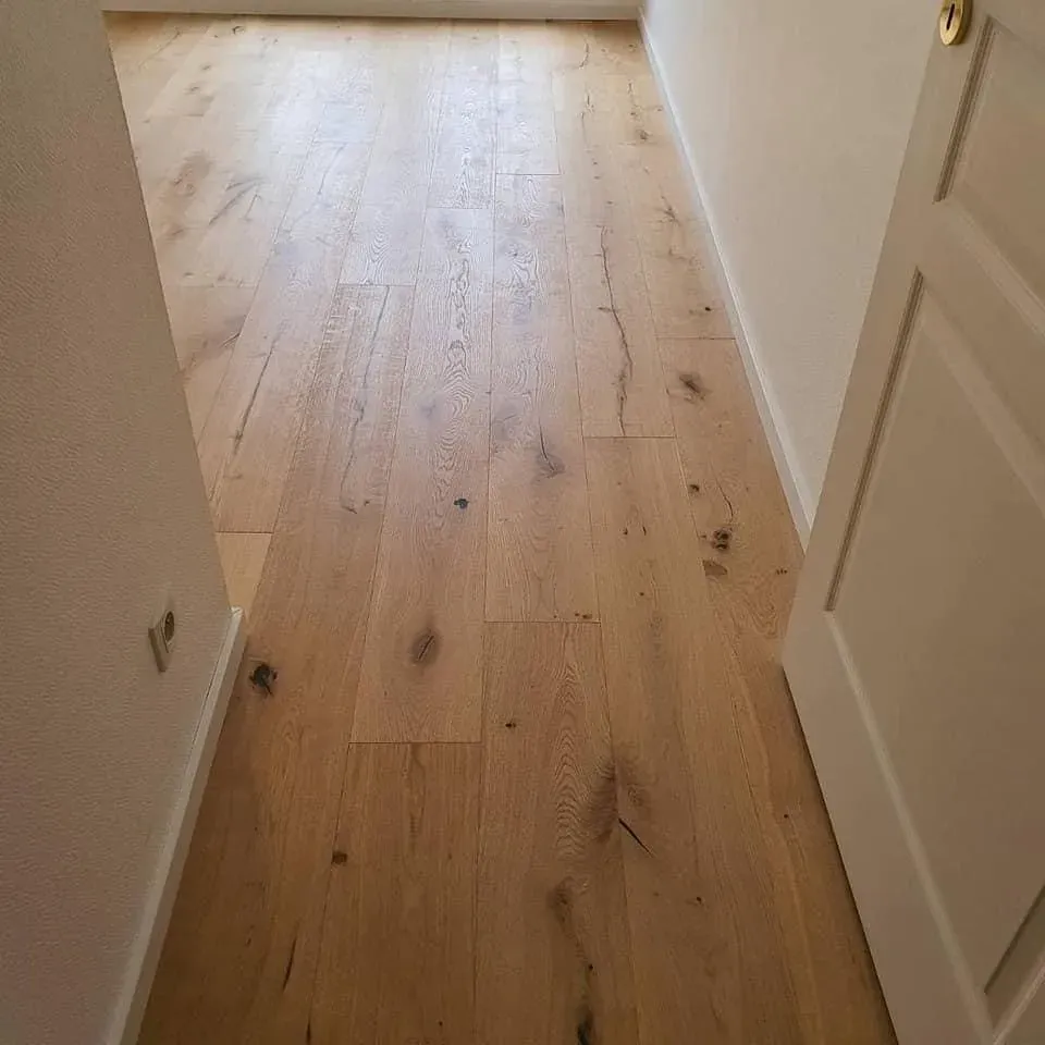 Pose d’un parquet contrecollé chêne brossé vernis dans le quartier de l’Orangerie à Strasbowebp